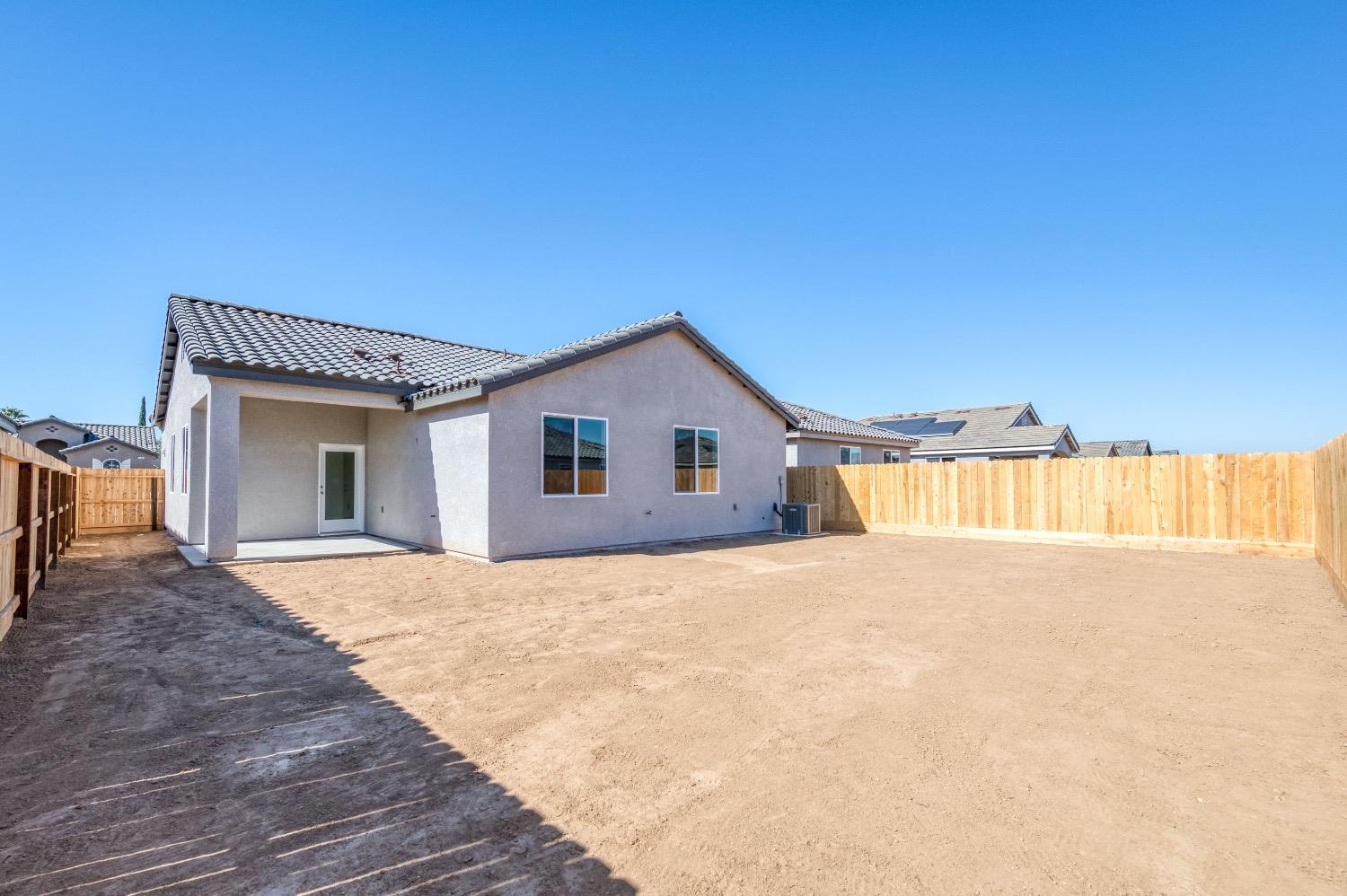 778 Shasta Street Madera, CA 93638 - Photo 25 of 28 a view of an house with backyard and a window