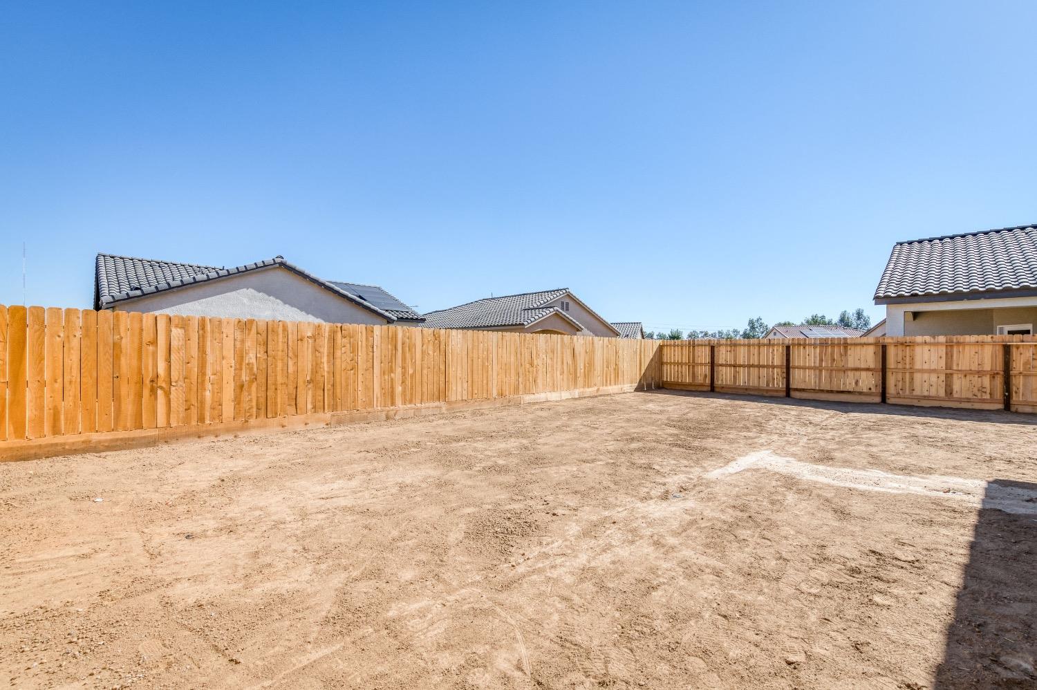 778 Shasta Street Madera, CA 93638 - Photo 27 of 28 a view of a swimming pool with a yard