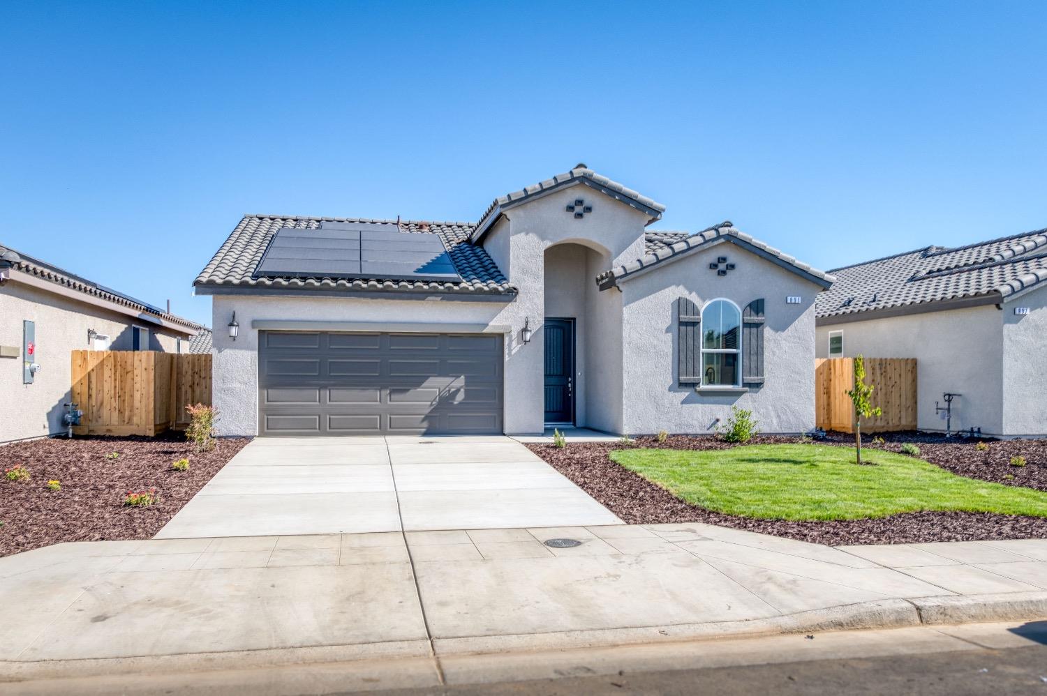 778 Shasta Street Madera, CA 93638 - Photo 6 of 28 a front view of a house with a yard and garage
