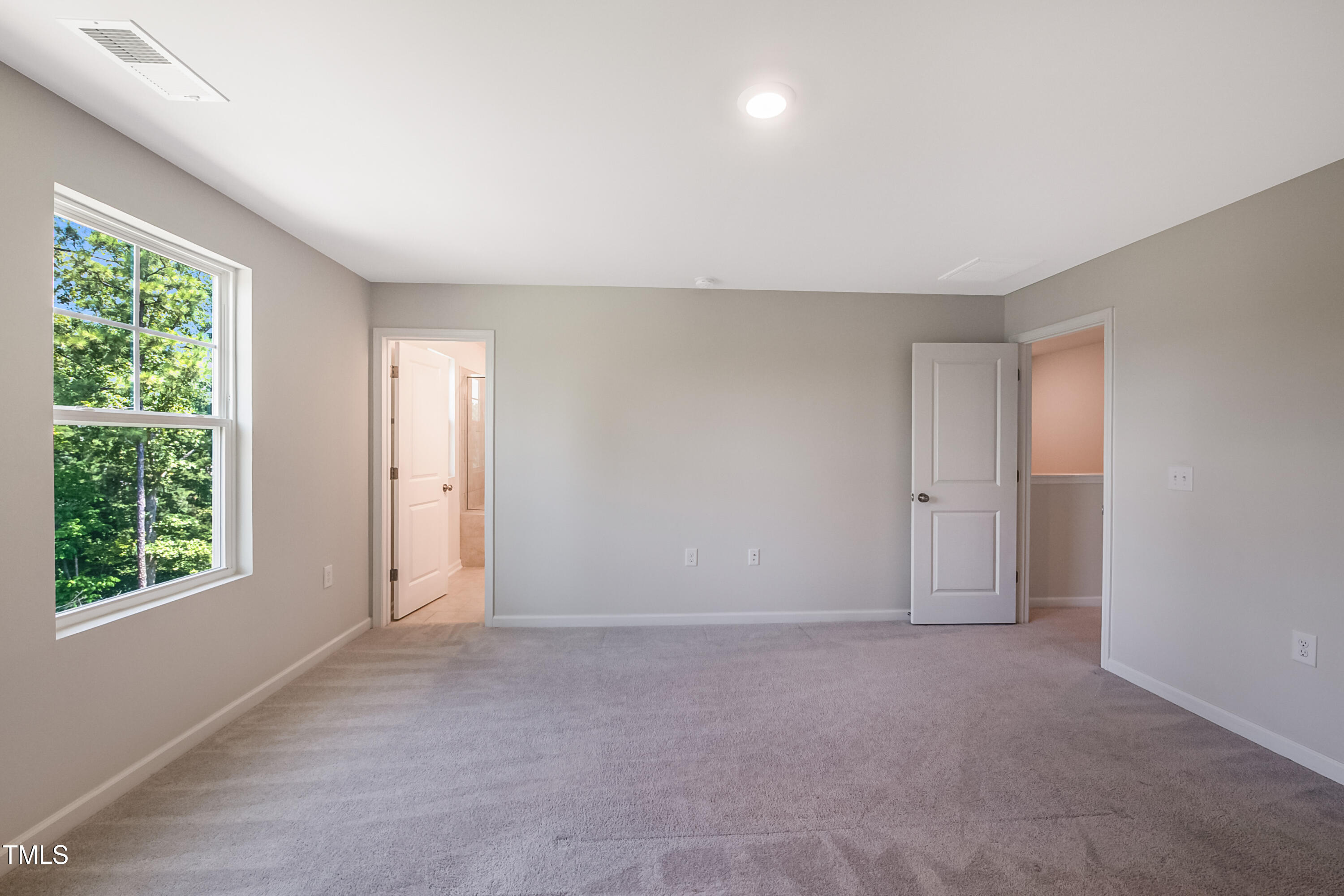 1032 Shoreside Drive Durham, NC 27713 - Photo 11 of 31 a view of an empty room with a window