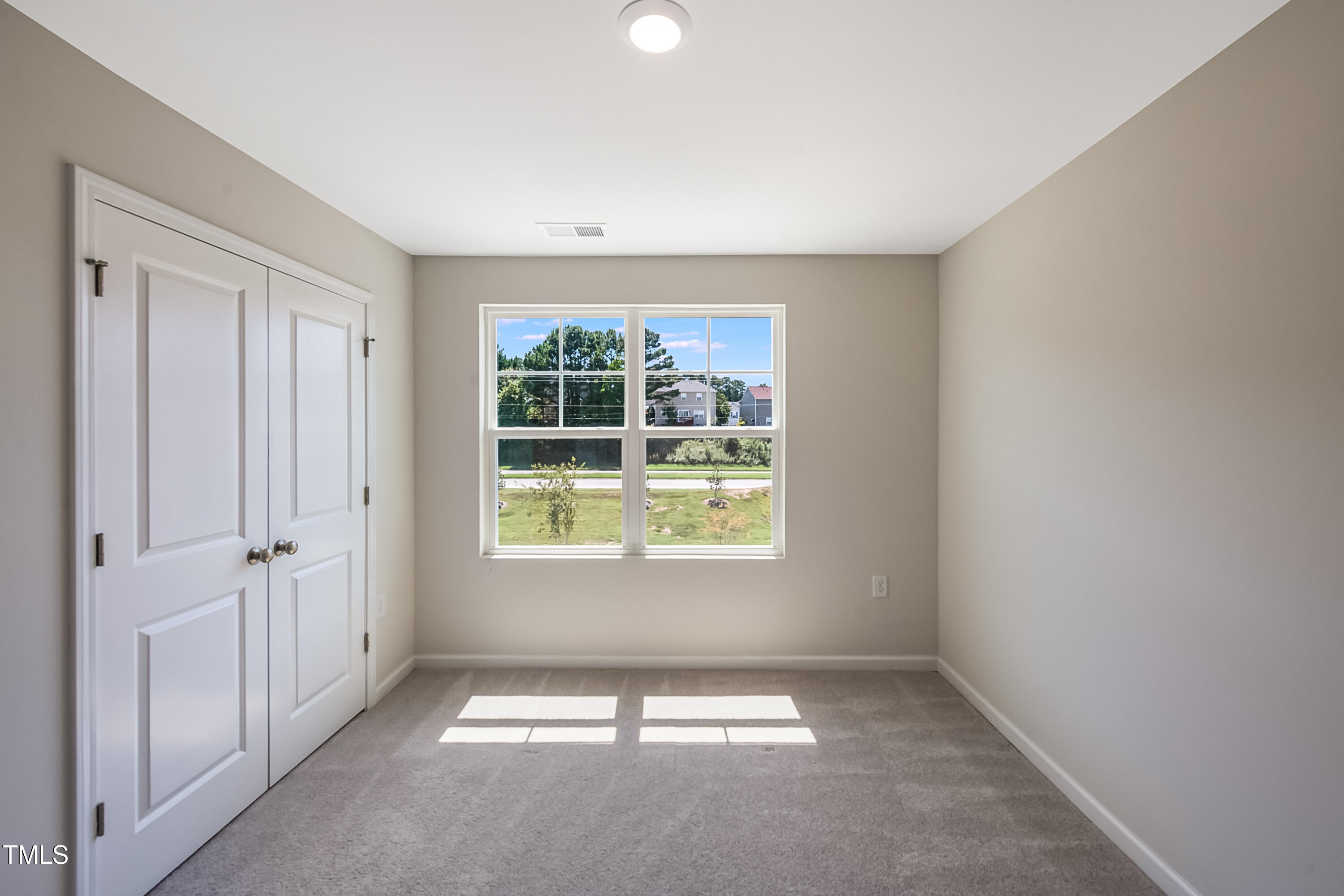 1032 Shoreside Drive Durham, NC 27713 - Photo 17 of 31 a view of an empty room with a window