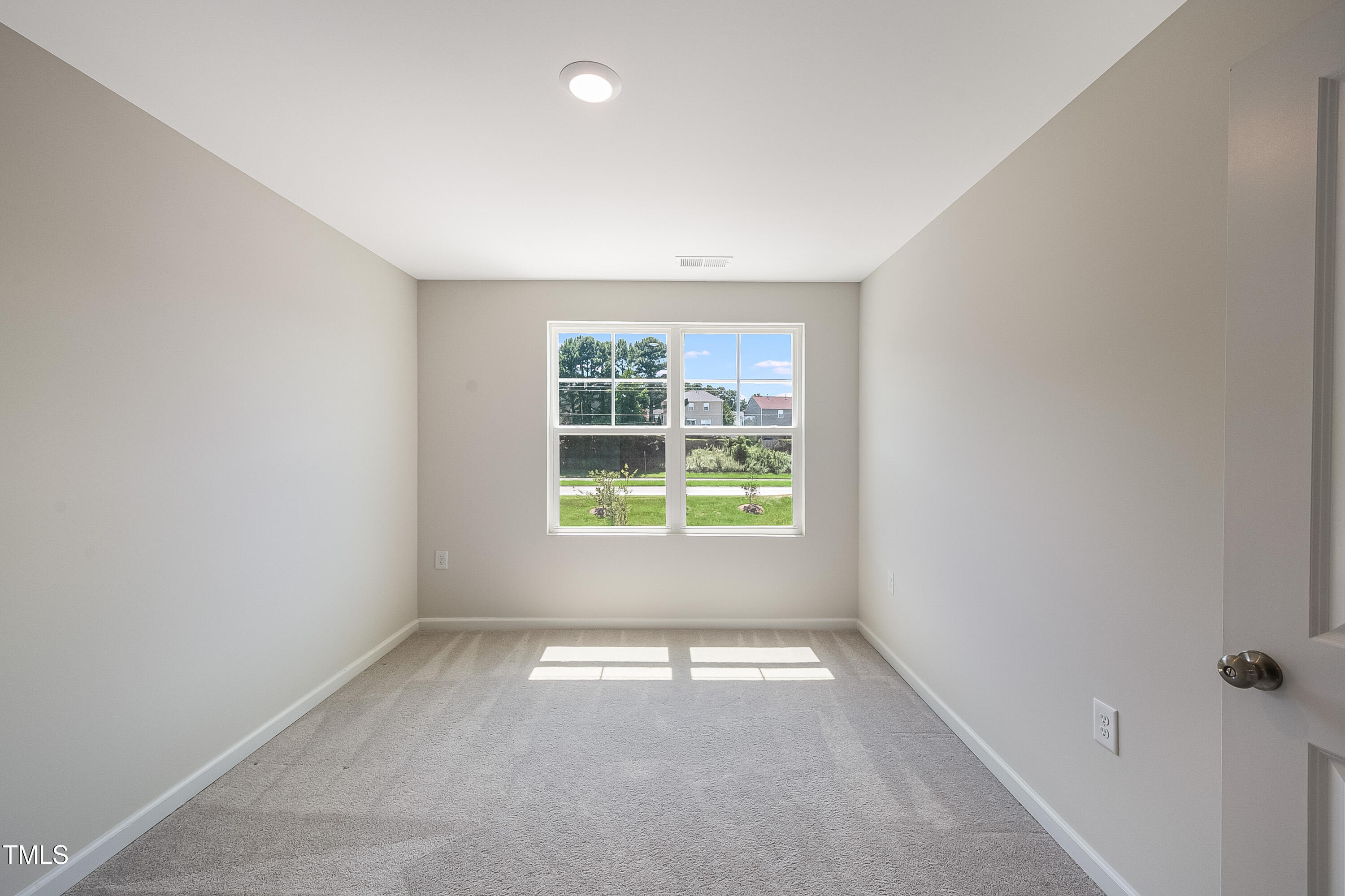 1032 Shoreside Drive Durham, NC 27713 - Photo 19 of 31 an empty room with windows