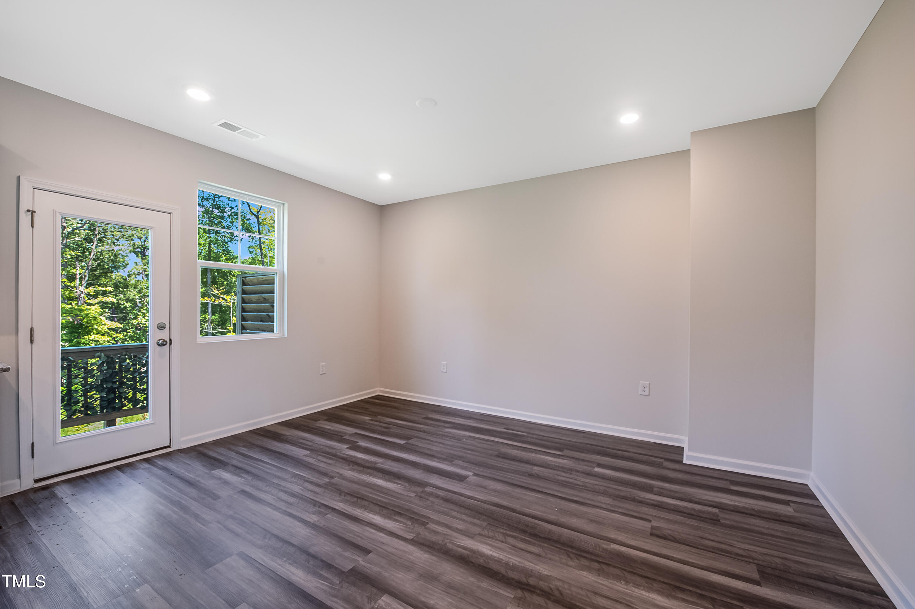1032 Shoreside Drive Durham, NC 27713 - Photo 5 of 31 wooden floor in an empty room with a window