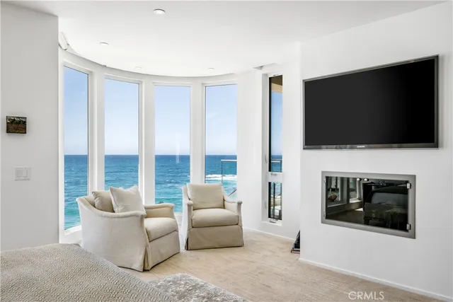 a large white kitchen with a large tub table and chairs