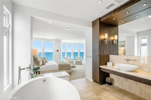 a living room with a couch and potted plant