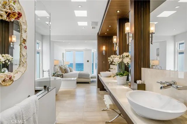 a bathroom with a sink double vanity and a mirror