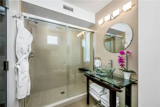 a bathroom with a sink a mirror and a window