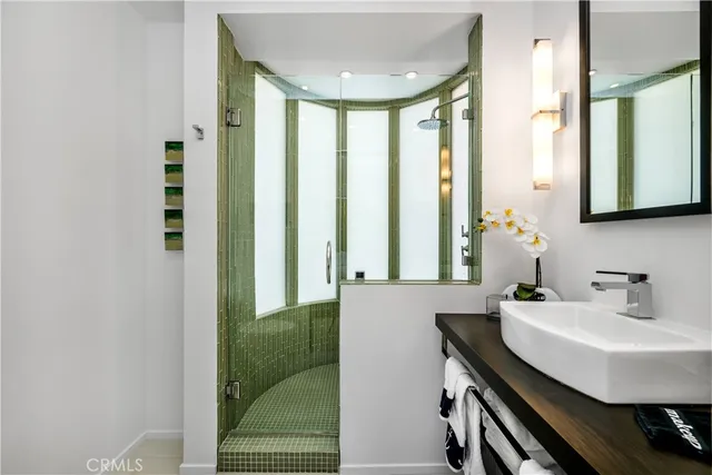 a bathroom with a sink toilet and mirror