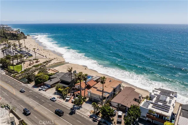 a view of a patio with chairs and table
