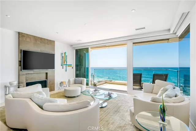 a living room with furniture fireplace and flat screen tv