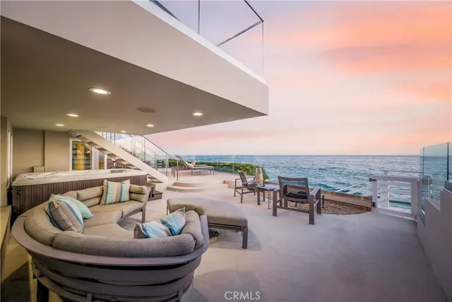 a kitchen with stainless steel appliances granite countertop table chairs sink and cabinets