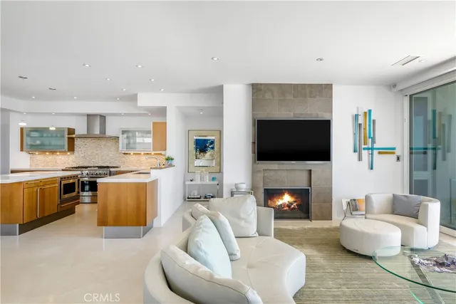 a kitchen with stainless steel appliances granite countertop a stove and a refrigerator