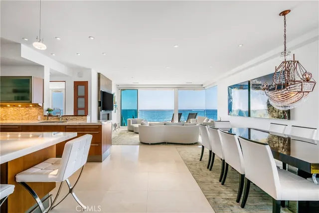 a kitchen with stainless steel appliances granite countertop a stove a sink dishwasher and a refrigerator