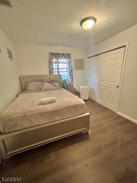 142 Mapes Avenue, Unit 3 Newark, NJ 07112 - Photo 4 of 8 a room with a bed and a window