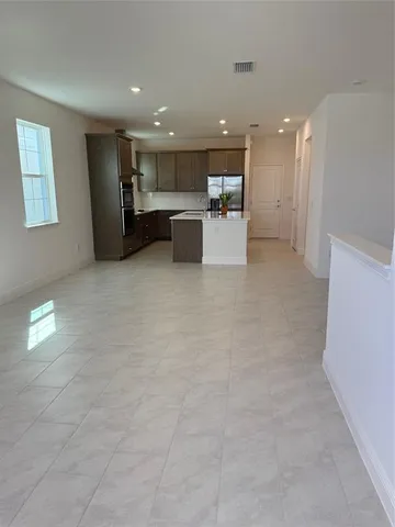 a view of kitchen with furniture and window