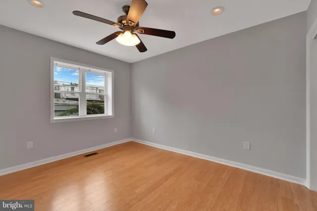 a bedroom with bed and a window