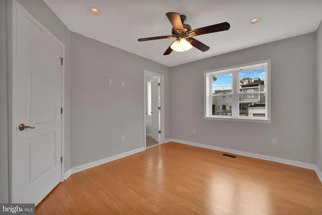 a big room with closet and a bathroom