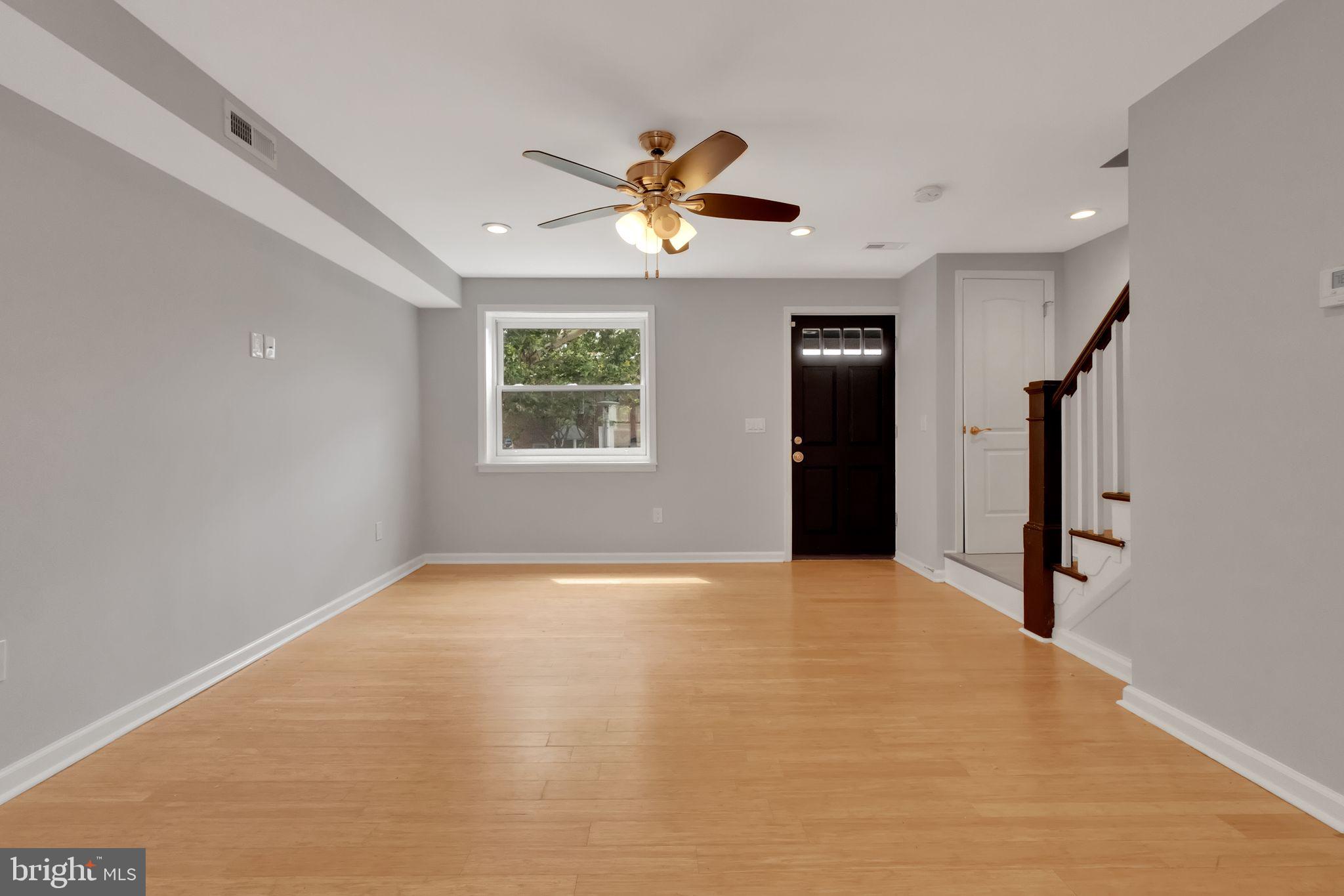 245 South Clinton Street Baltimore, MD 21224 - Photo 2 of 39 a view of an empty room with a window