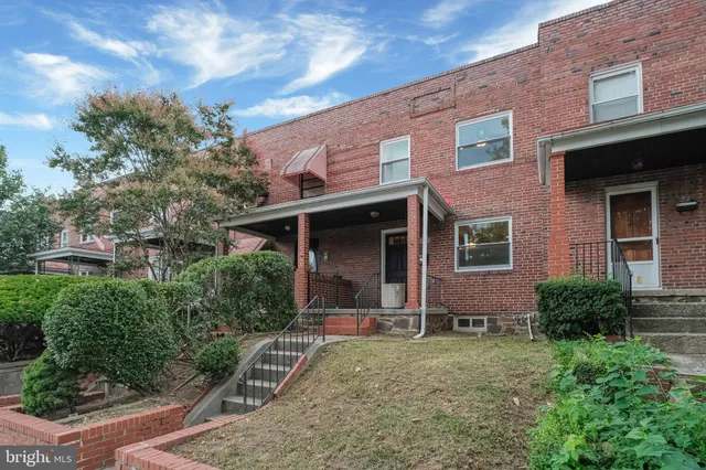 a view of a patio with a table and chairs