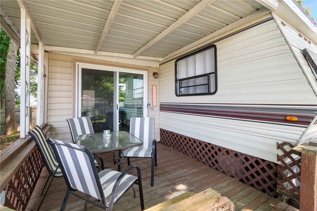 7945 Lake Road, Unit 129 Sodus, NY 14555 - Photo 8 of 22 Enjoy the private deck with a morning beverage!