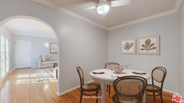 a dining room with furniture and chandelier