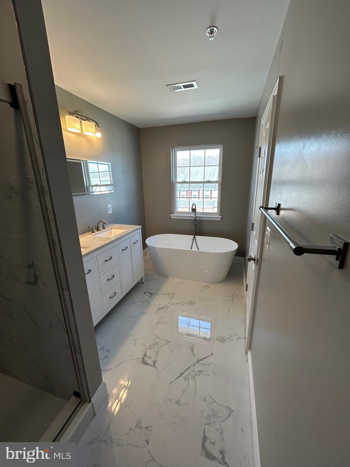 4739 Witchhazel Way Aberdeen, MD 21001 - Photo 13 of 32 a spacious bathroom with a tub sink and mirror