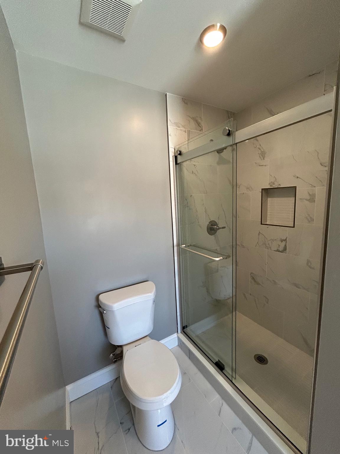 4739 Witchhazel Way Aberdeen, MD 21001 - Photo 15 of 32 a bathroom with a shower a toilet and a sink