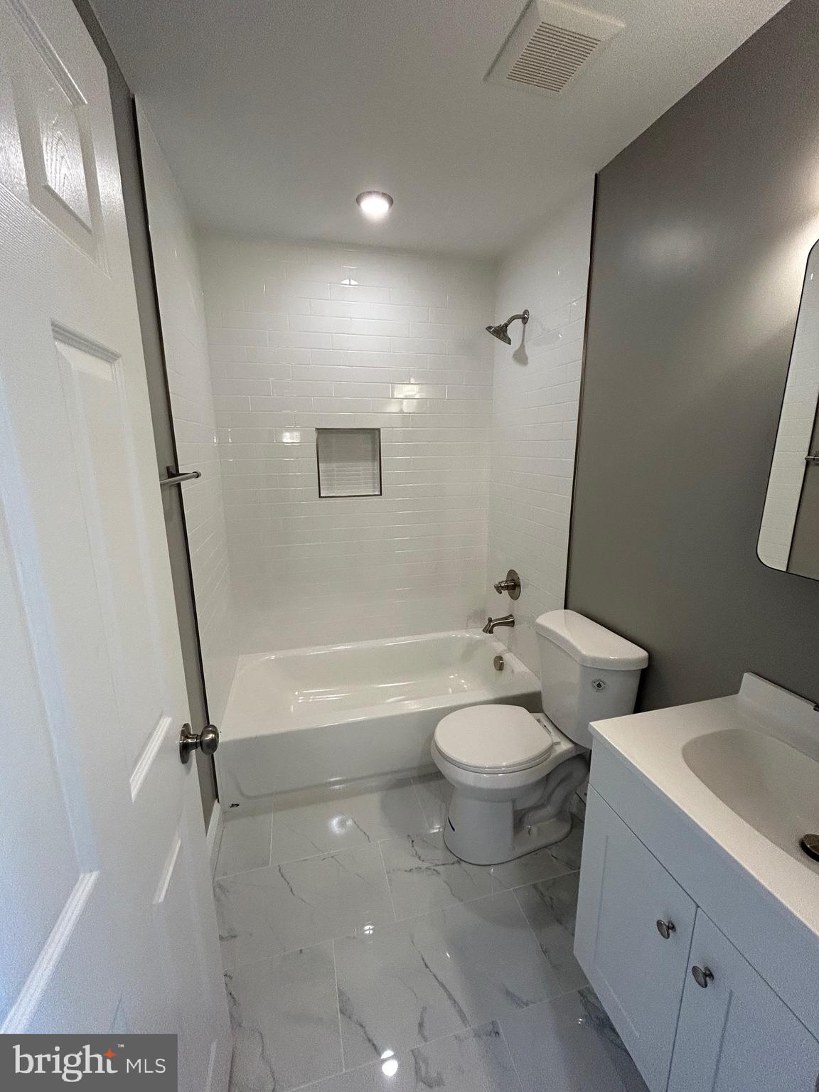 4739 Witchhazel Way Aberdeen, MD 21001 - Photo 21 of 32 a bathroom with a granite countertop toilet a sink and a mirror