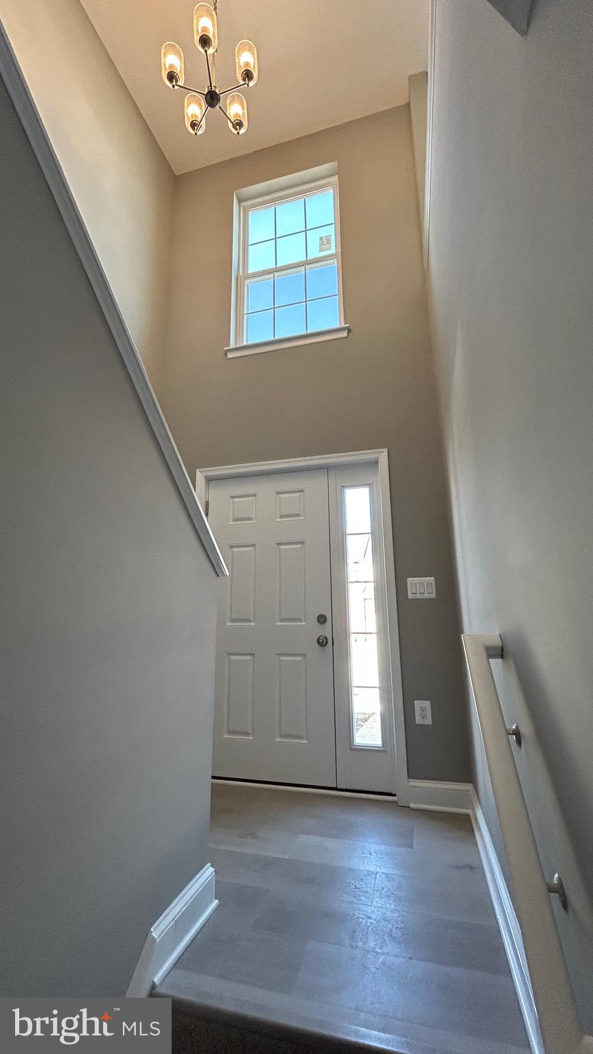 4739 Witchhazel Way Aberdeen, MD 21001 - Photo 25 of 32 a view of an empty room with wooden floor and a window