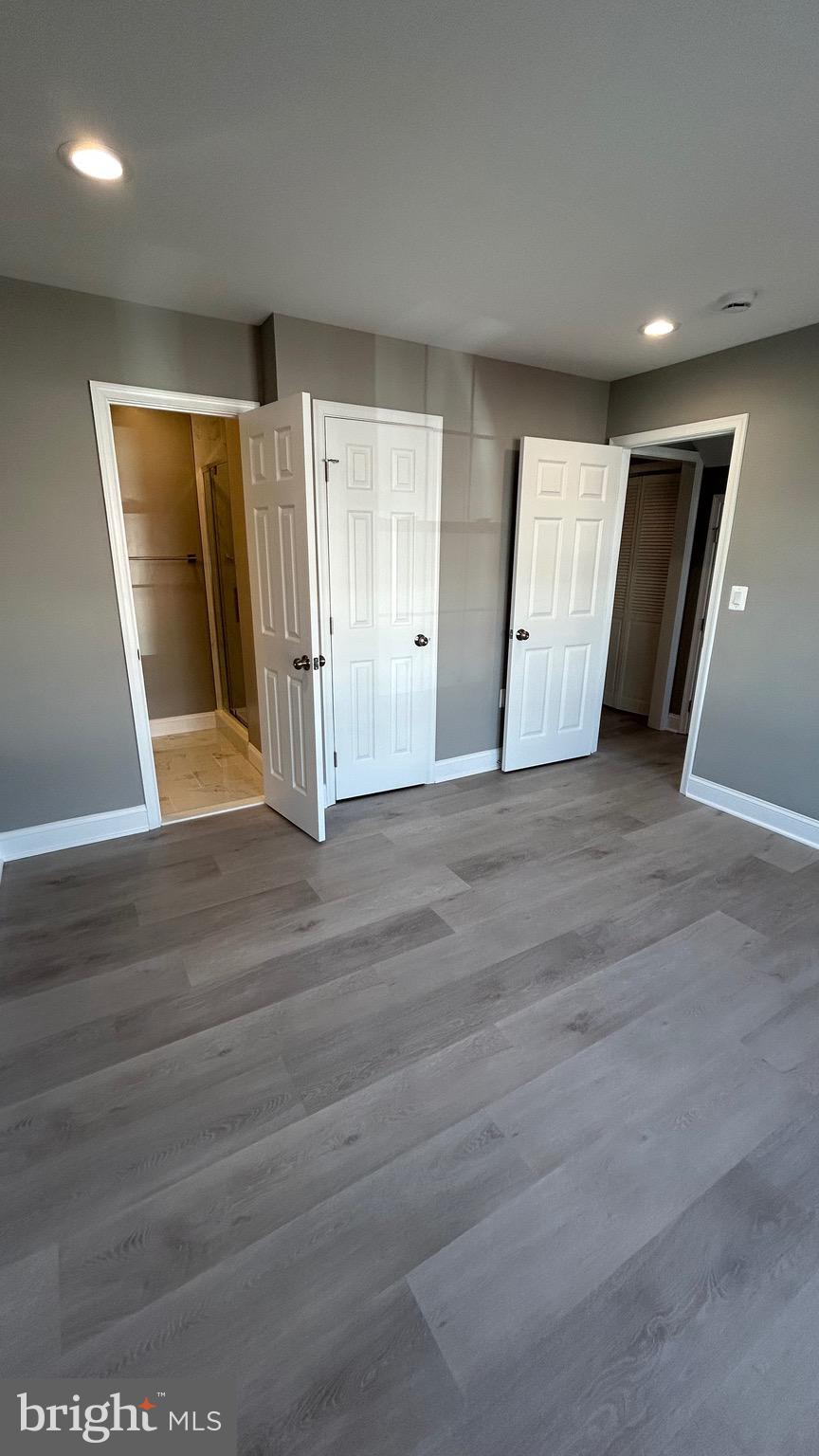 4739 Witchhazel Way Aberdeen, MD 21001 - Photo 28 of 32 an empty room with wooden floor and windows