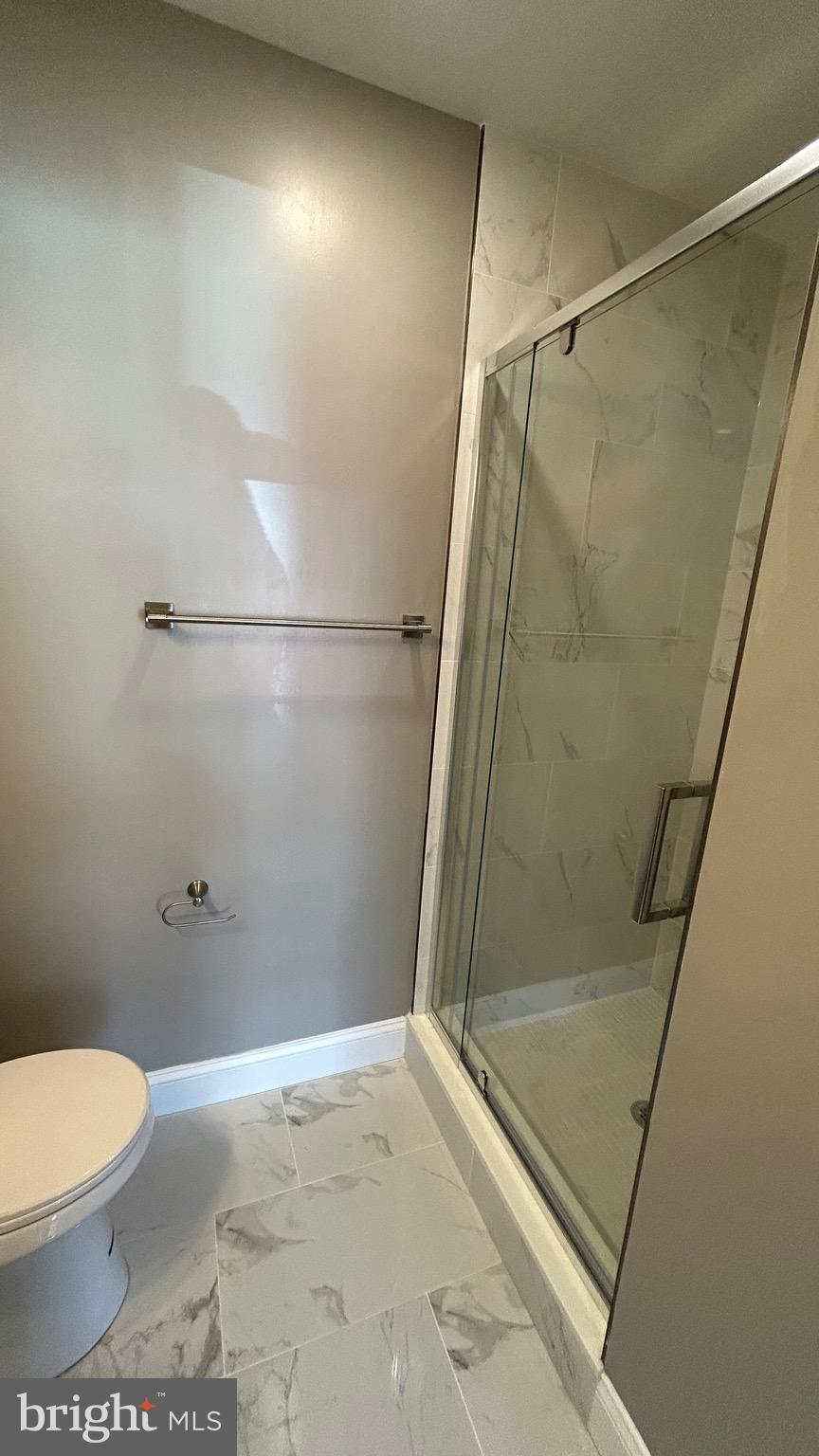 4739 Witchhazel Way Aberdeen, MD 21001 - Photo 30 of 32 a bathroom with a shower and a toilet