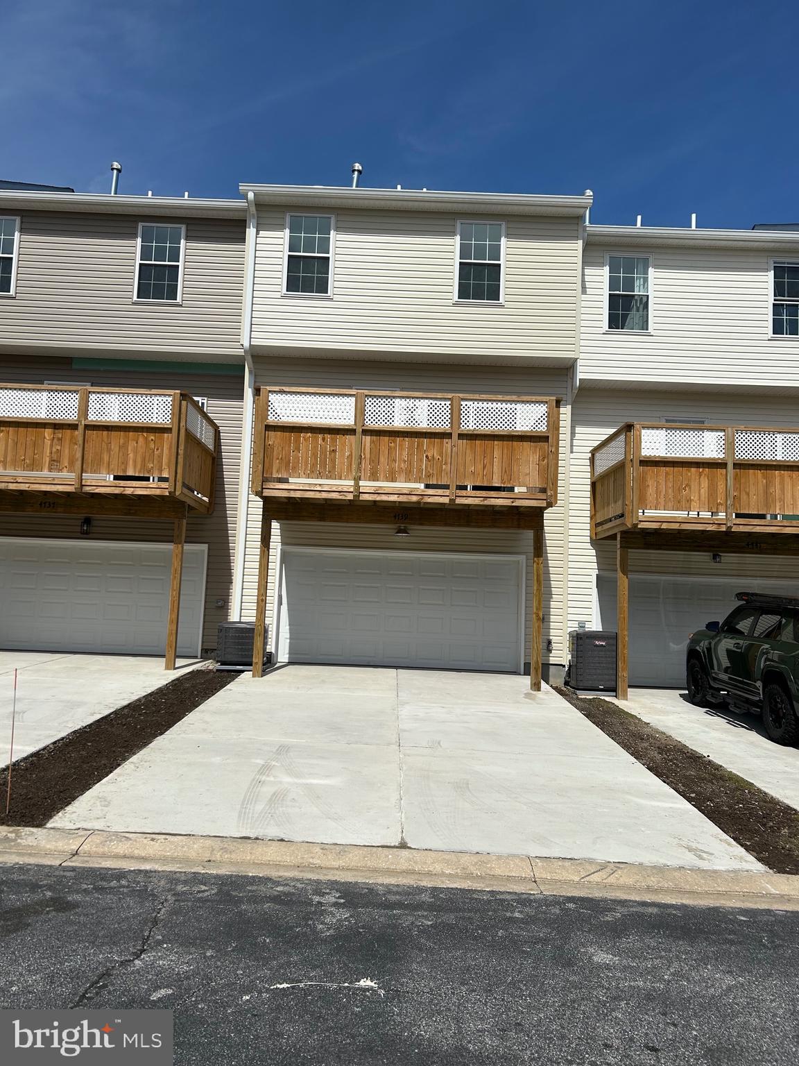 4739 Witchhazel Way Aberdeen, MD 21001 - Photo 32 of 32 a large white building with a stove and a refrigerator