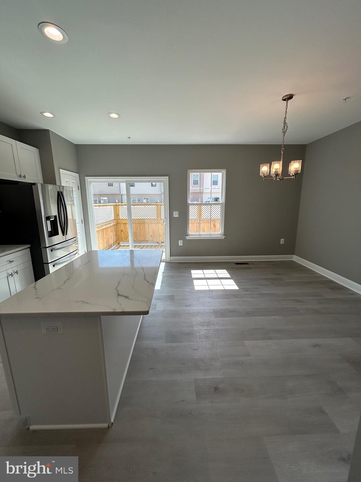 4739 Witchhazel Way Aberdeen, MD 21001 - Photo 7 of 32 a view of an empty room with window and wooden floor