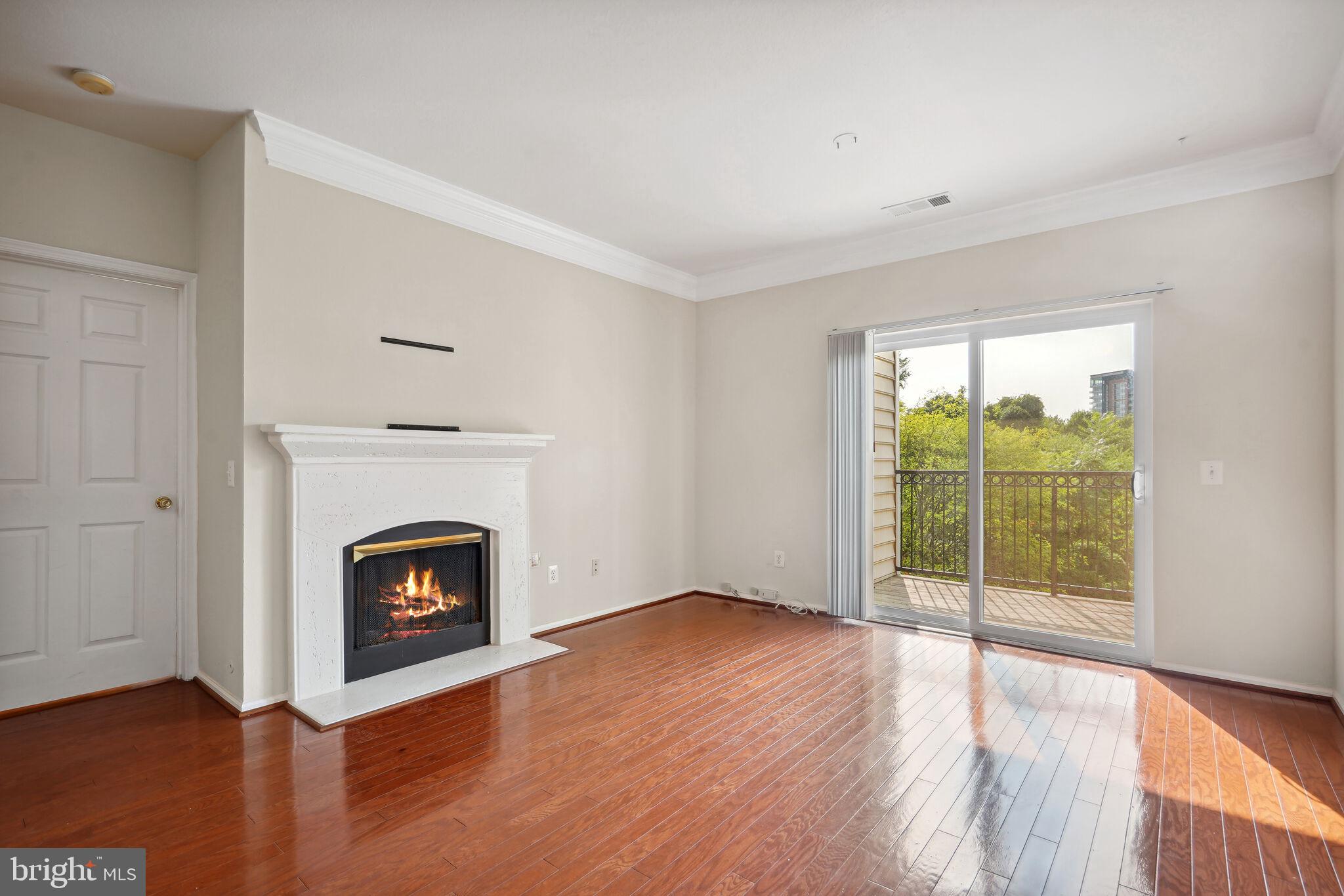 1581 Spring Gate Dr., Unit 5212 McLean, VA 22102 - Photo 3 of 27 Living room w/ fireplace