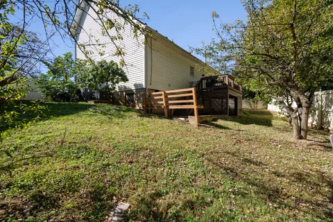 a backyard of a house with lots of green space