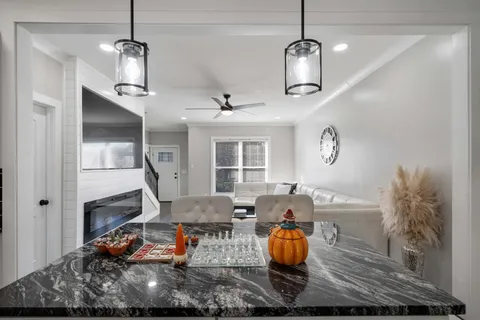 a living room with lots of furniture and windows