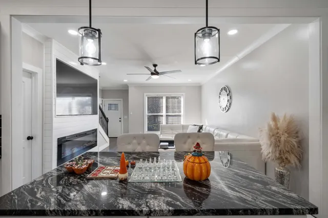 a living room with lots of furniture and windows