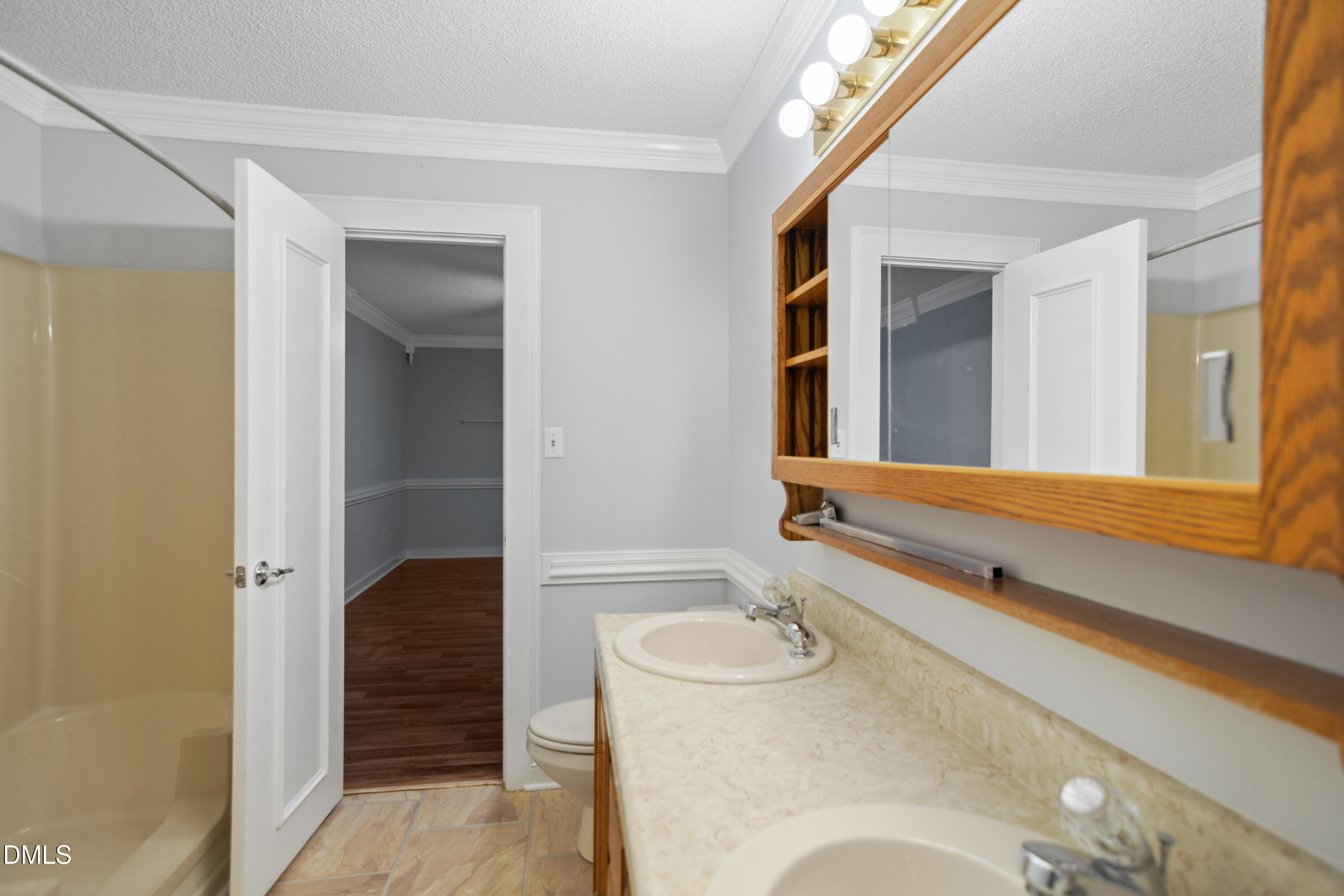 3614 Top Of The Pines Court Raleigh, NC 27604 - Photo 14 of 20 a bathroom with a sink and mirror