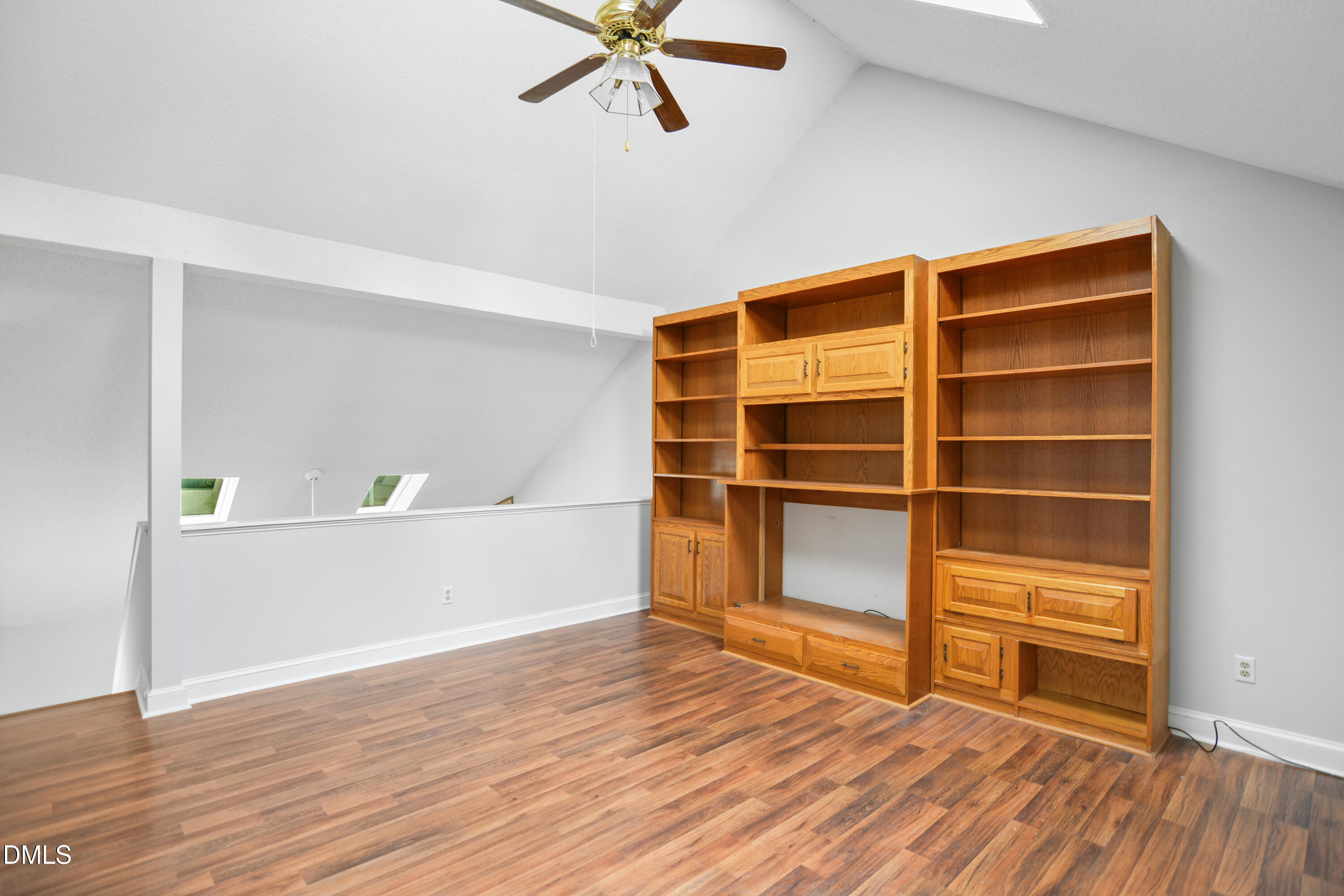 3614 Top Of The Pines Court Raleigh, NC 27604 - Photo 16 of 20 a view of an empty room with a window and wooden floor