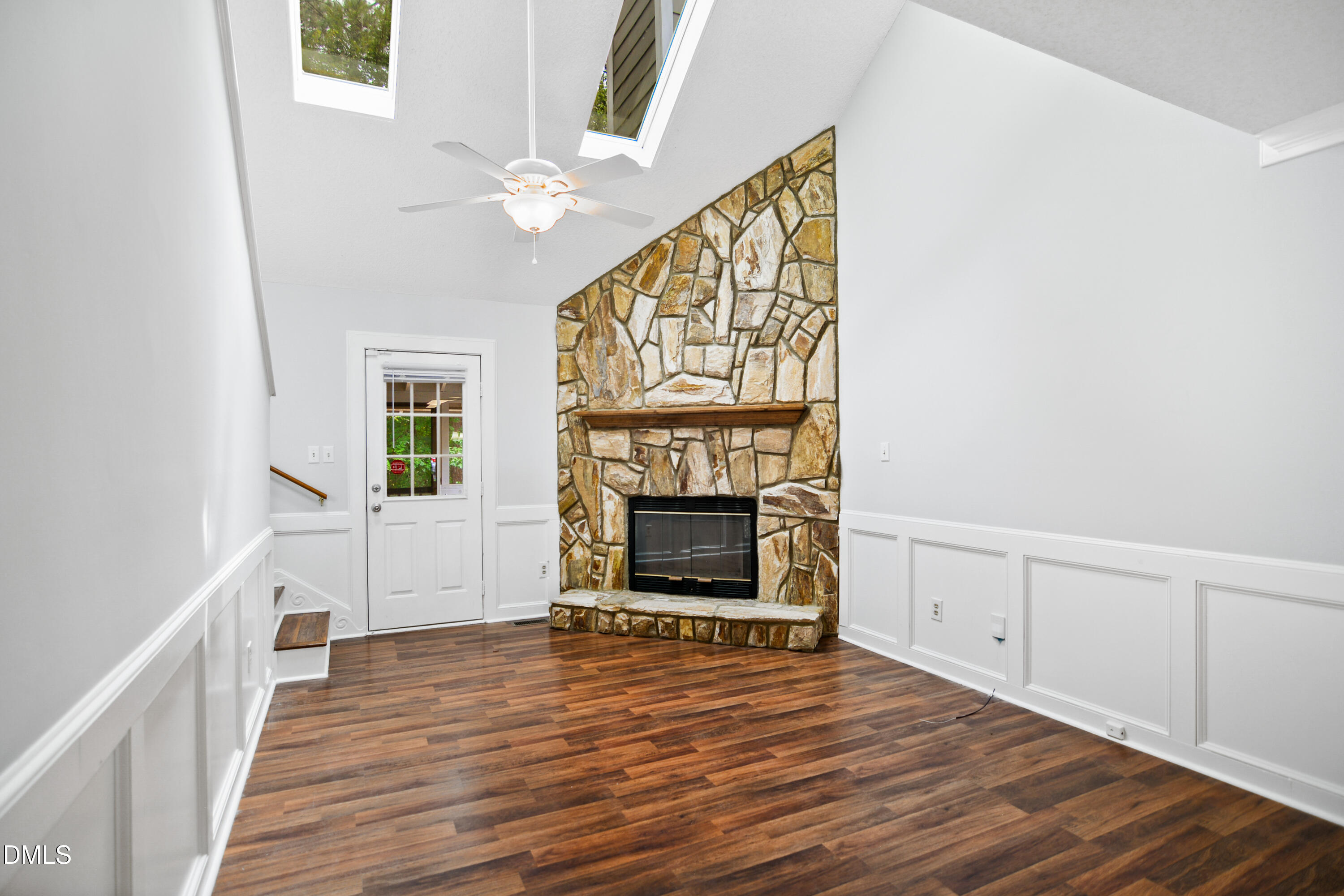 3614 Top Of The Pines Court Raleigh, NC 27604 - Photo 2 of 20 a view of an empty room with wooden floor and a window