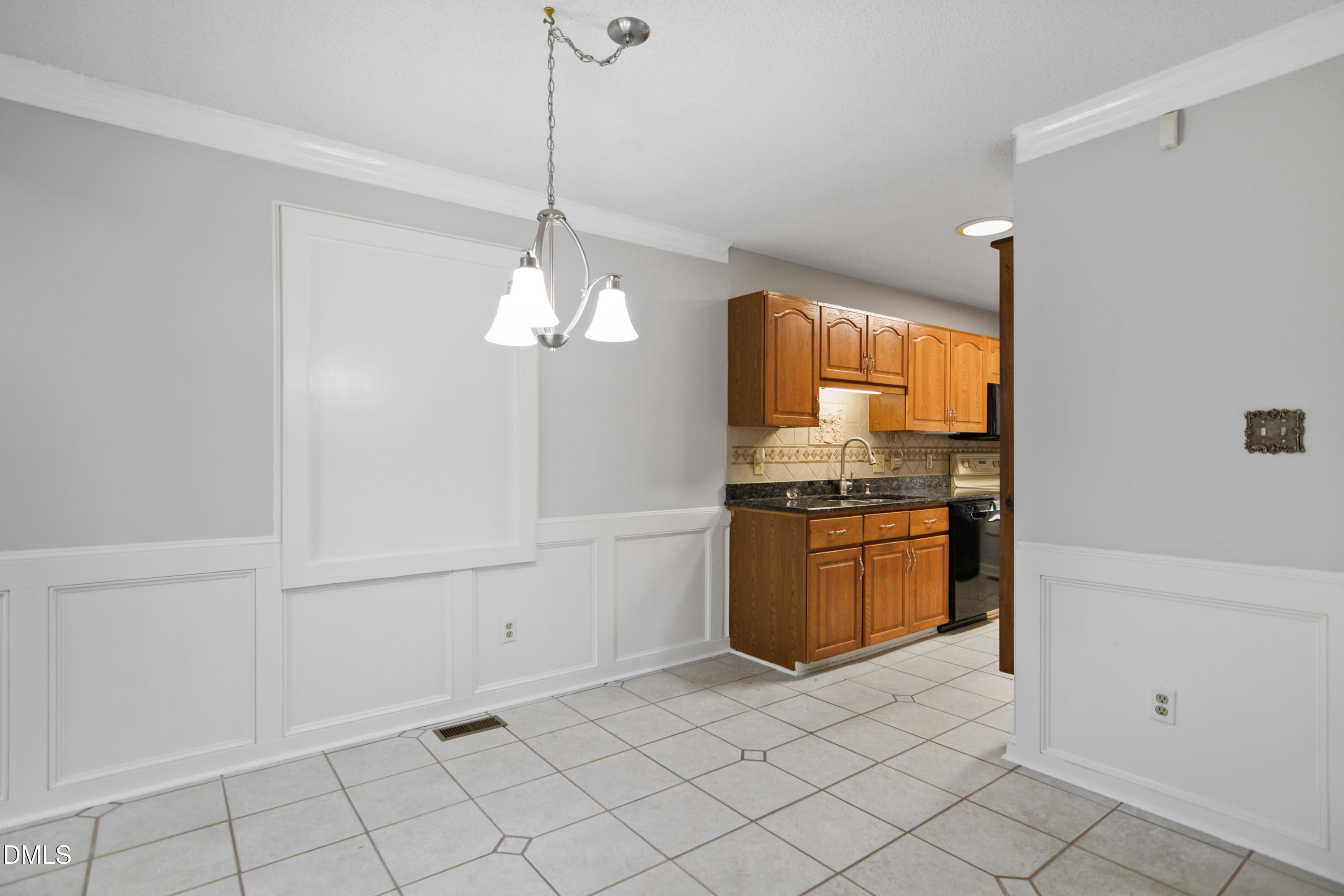 3614 Top Of The Pines Court Raleigh, NC 27604 - Photo 4 of 20 a kitchen with stainless steel appliances granite countertop a sink and a refrigerator