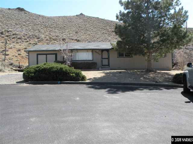 8830 Paloma Way Reno, NV 89506 - Photo 1 of 7 a front view of a house with a yard