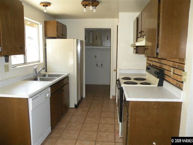 8830 Paloma Way Reno, NV 89506 - Photo 4 of 7 a kitchen with a sink stove and refrigerator