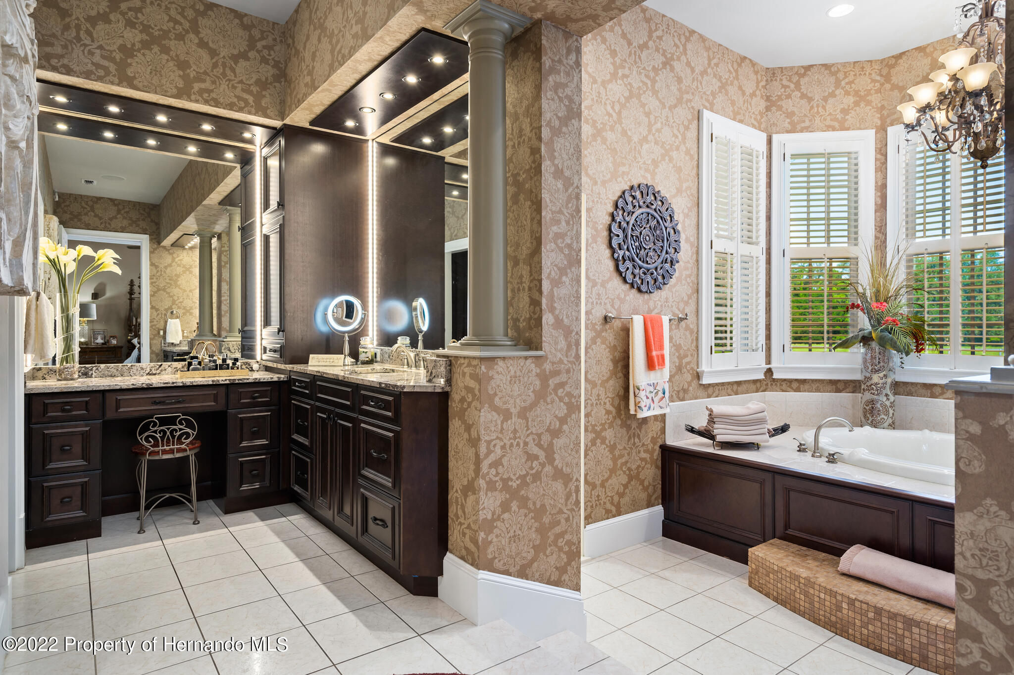 21411 Brookes Run Road Brooksville, FL 34602 - Photo 24 of 62 a spacious bathroom with a sink mirror and tub