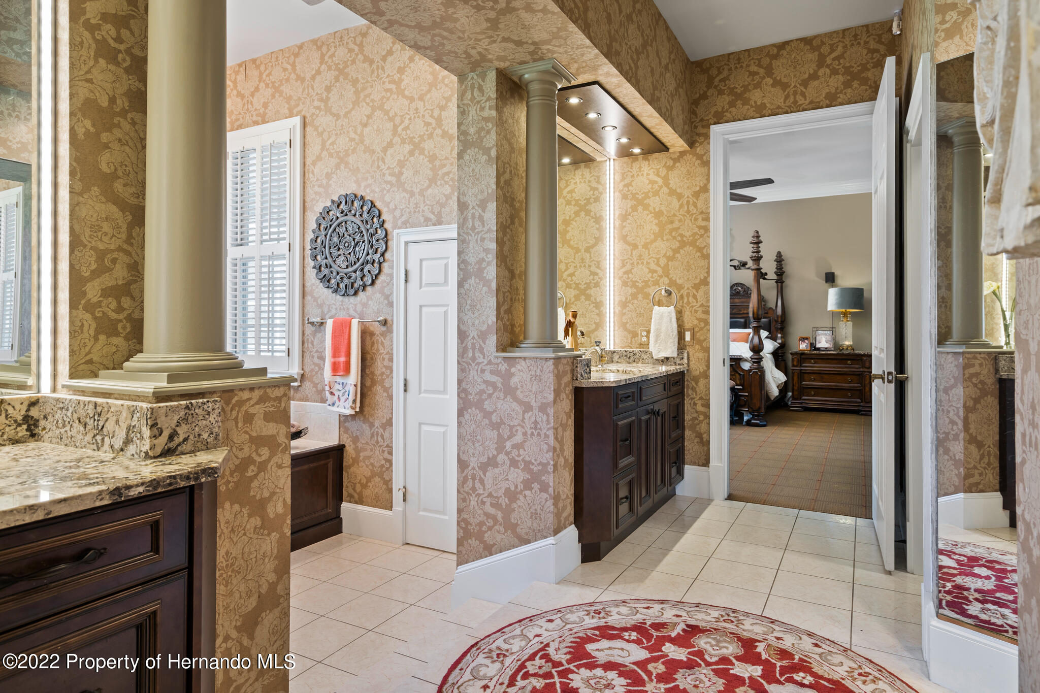 21411 Brookes Run Road Brooksville, FL 34602 - Photo 26 of 62 a spacious bathroom with a mirror and a sink