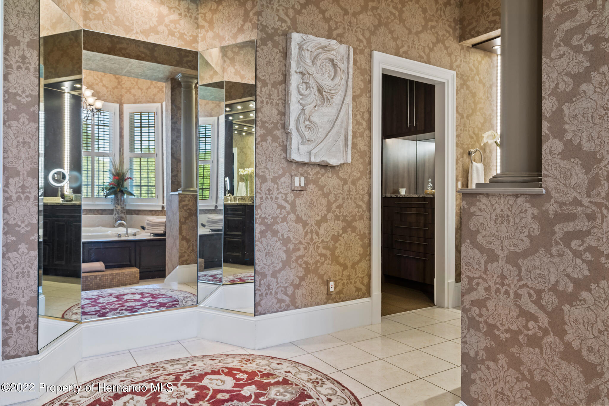 21411 Brookes Run Road Brooksville, FL 34602 - Photo 27 of 62 a spacious bathroom with a granite countertop shower and a mirror