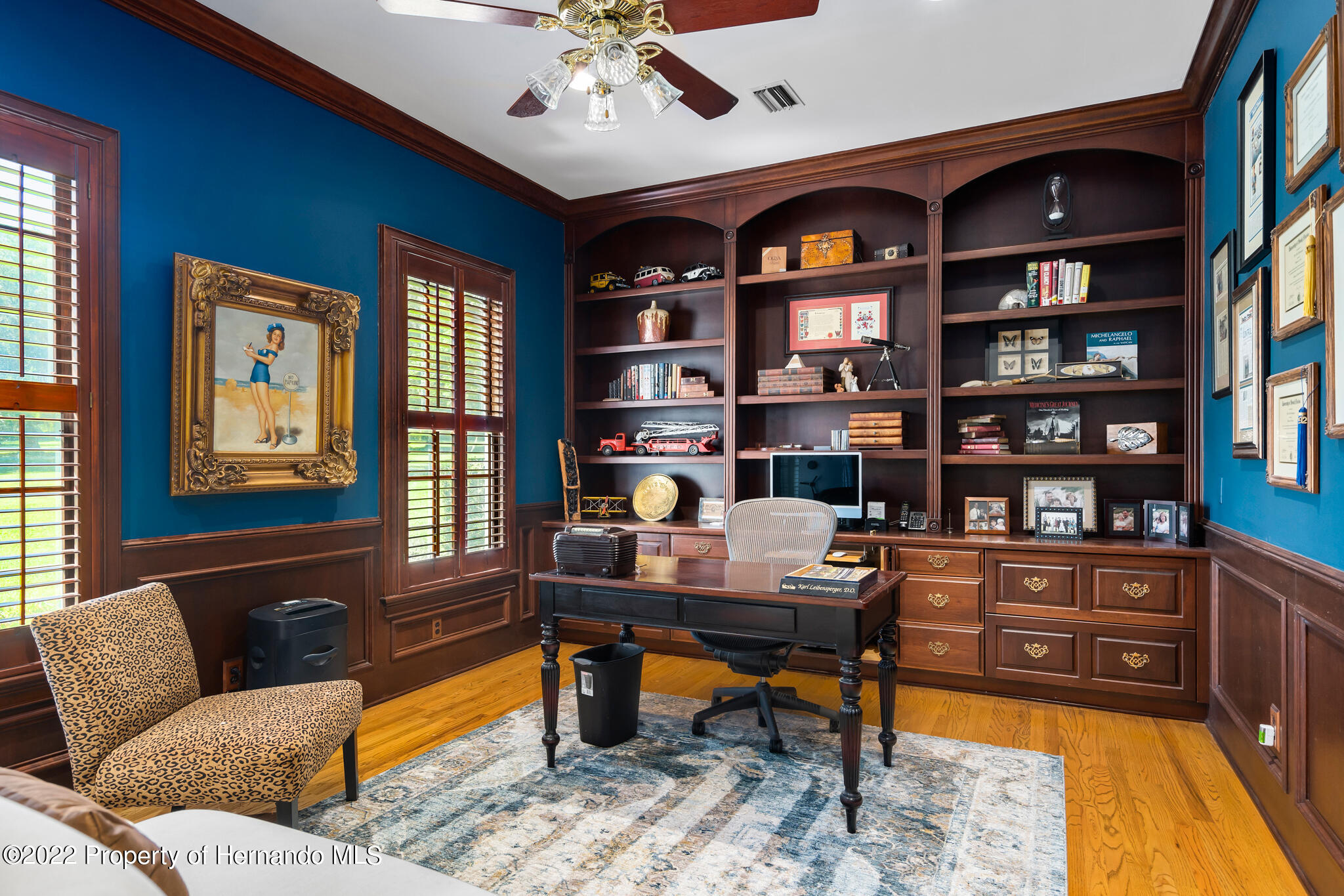 21411 Brookes Run Road Brooksville, FL 34602 - Photo 28 of 62 a livingroom with workspace and a couch