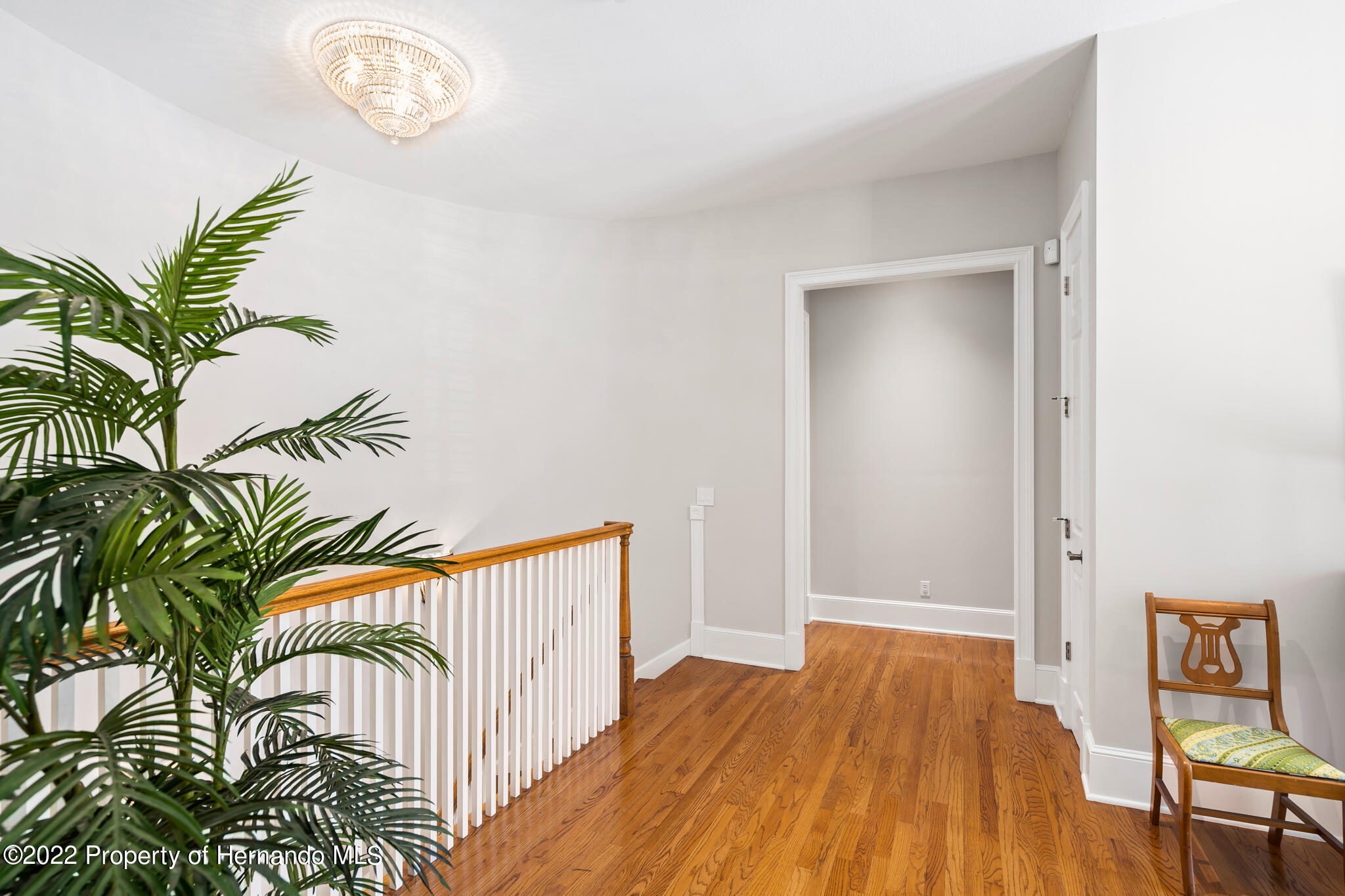 21411 Brookes Run Road Brooksville, FL 34602 - Photo 30 of 62 a view of a hallway with wooden floor
