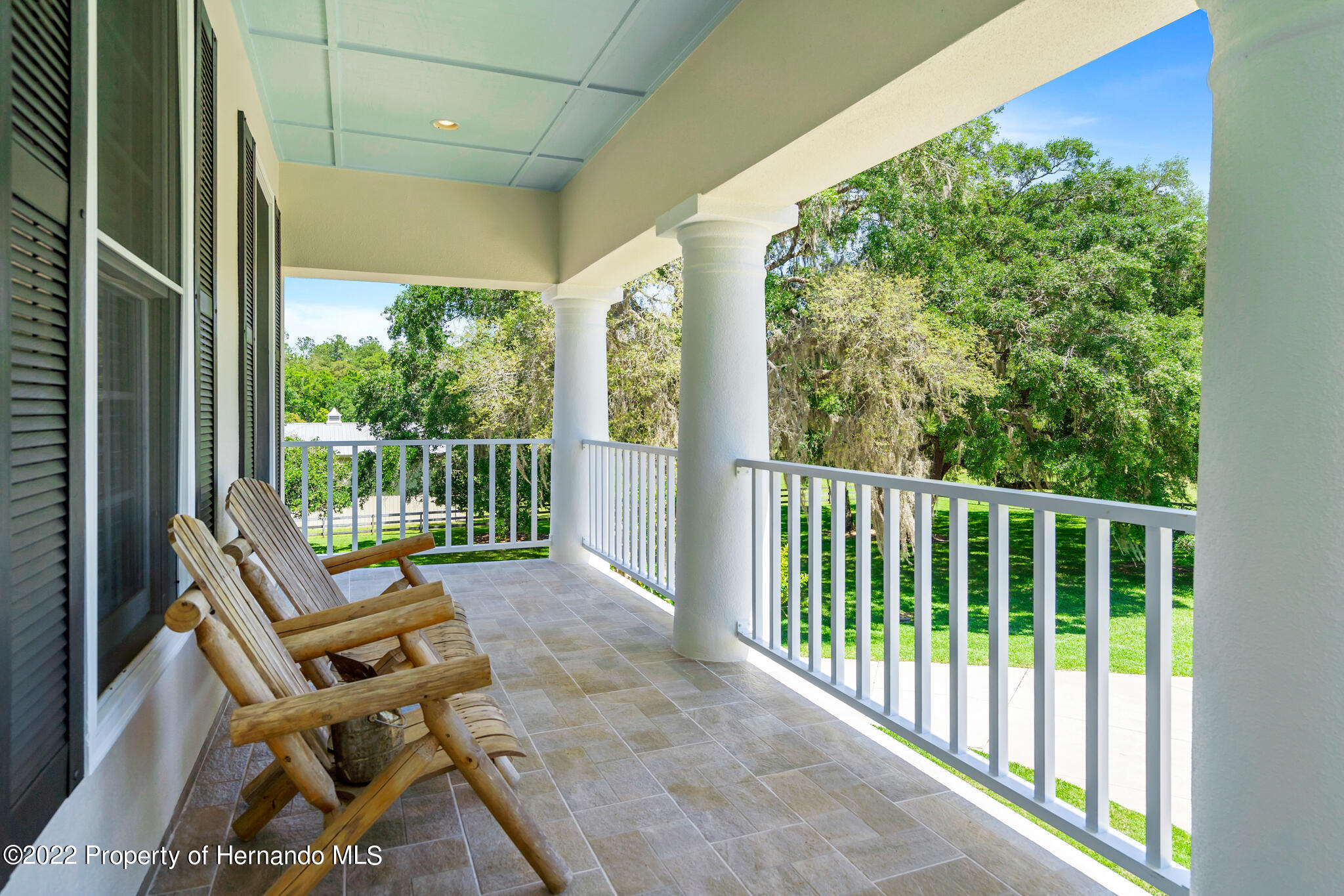 21411 Brookes Run Road Brooksville, FL 34602 - Photo 33 of 62 a view of a two chair in the balcony