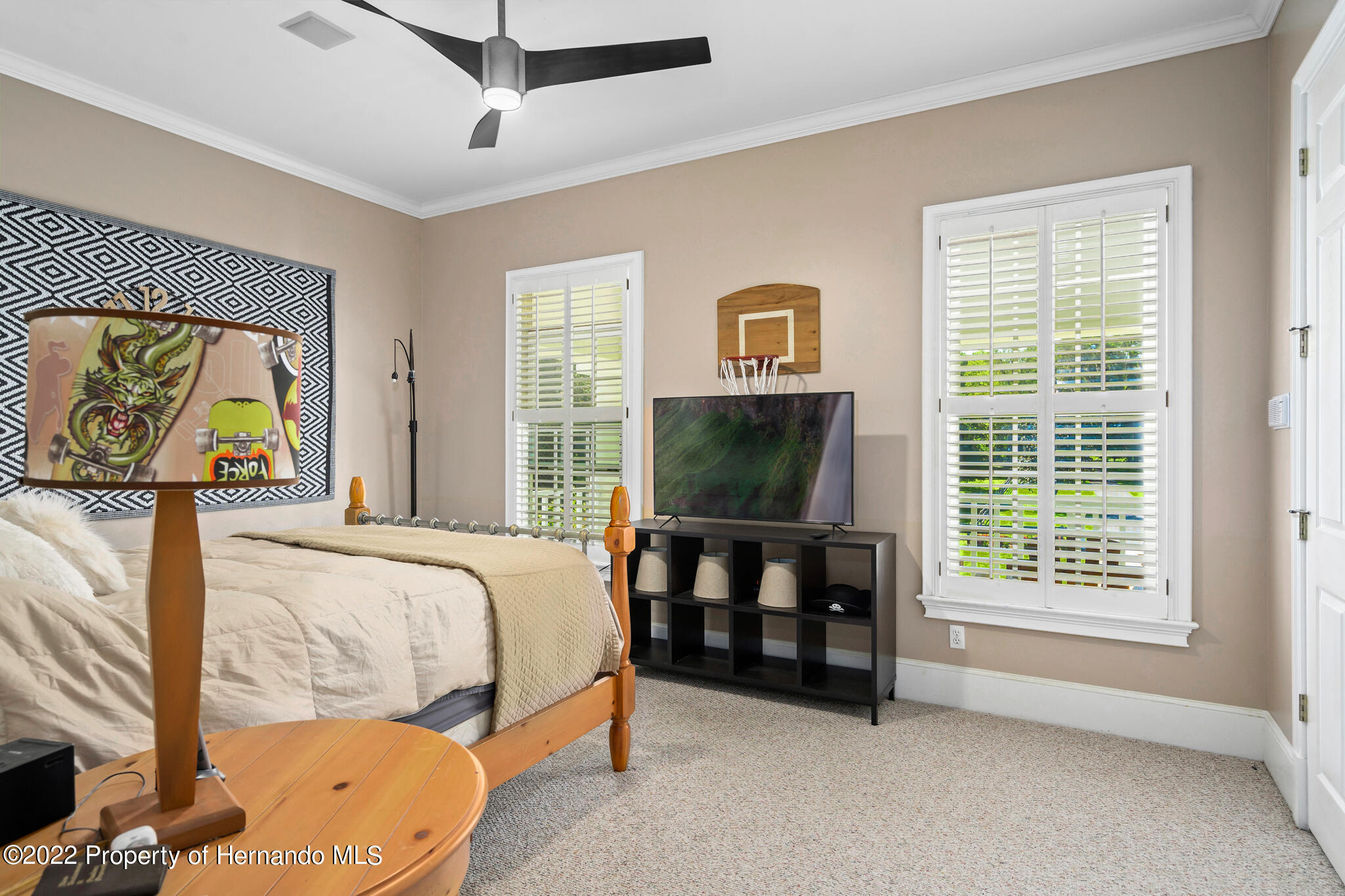 21411 Brookes Run Road Brooksville, FL 34602 - Photo 38 of 62 a bed room with a bed and a television